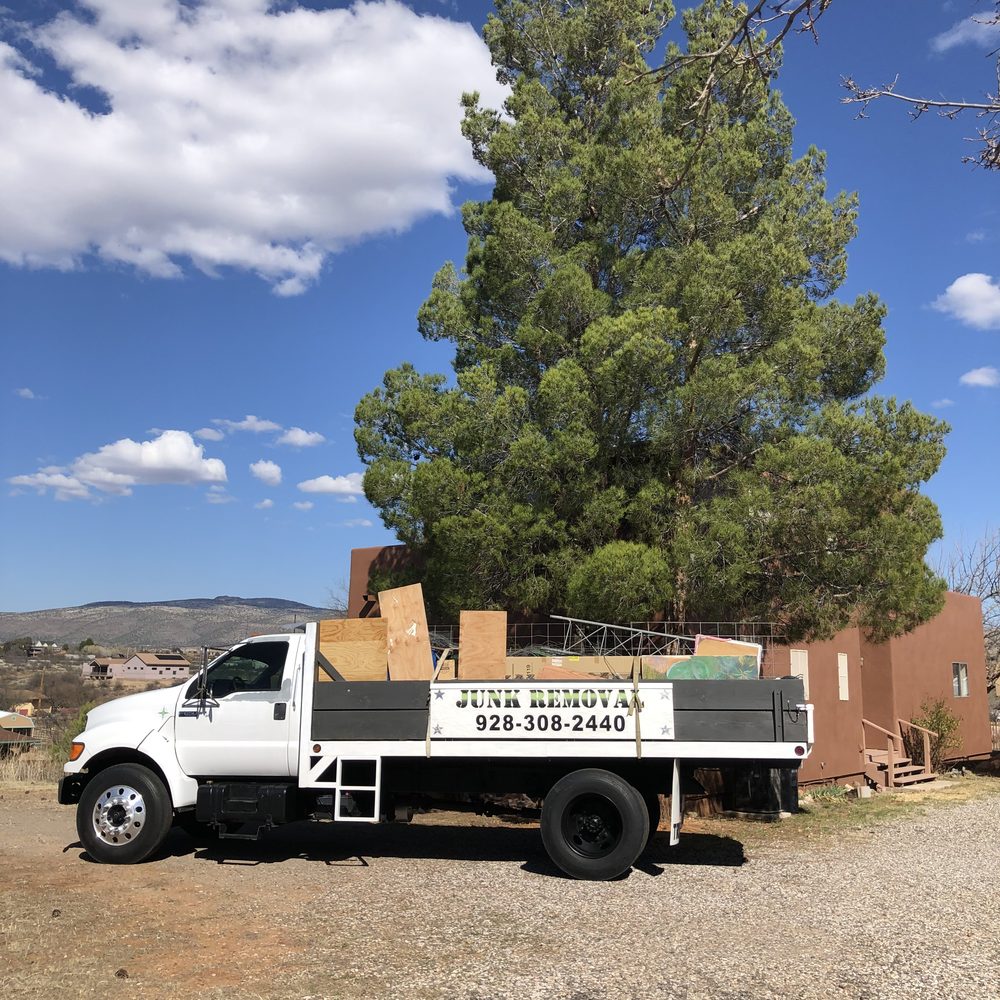 True West dump truck loaded with construction debris at an Arizona property