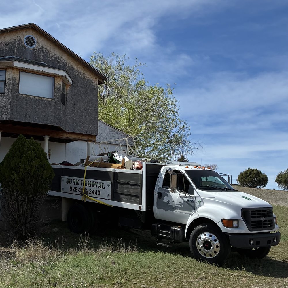 True West truck parked at a rural Arizona home during a cleanout