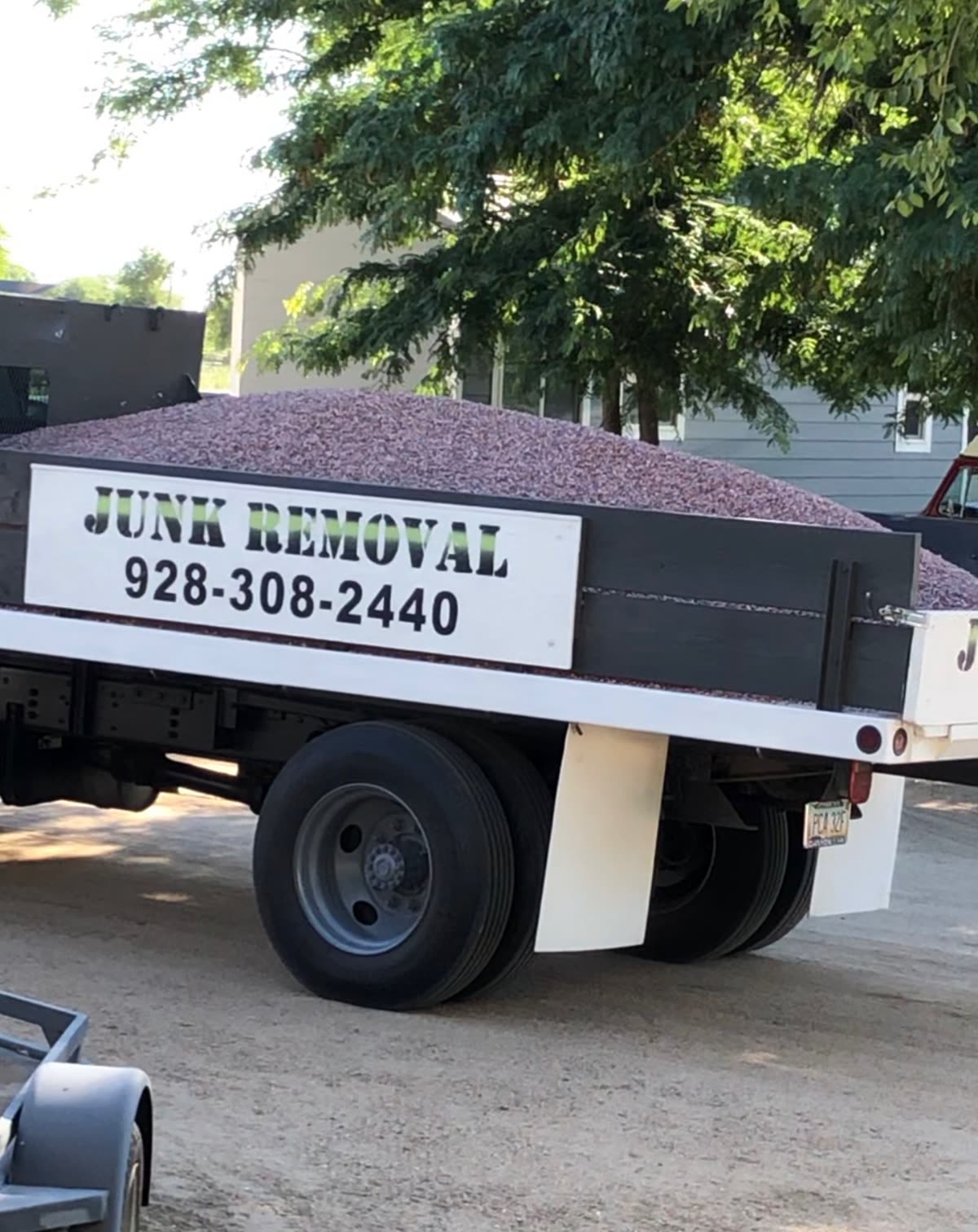 True West dump truck loaded with decorative landscape rock